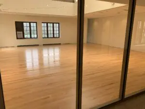 An empty hall with windows and lights