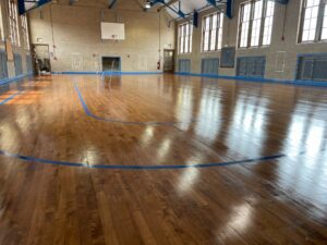 A basketball court with hardwood floor